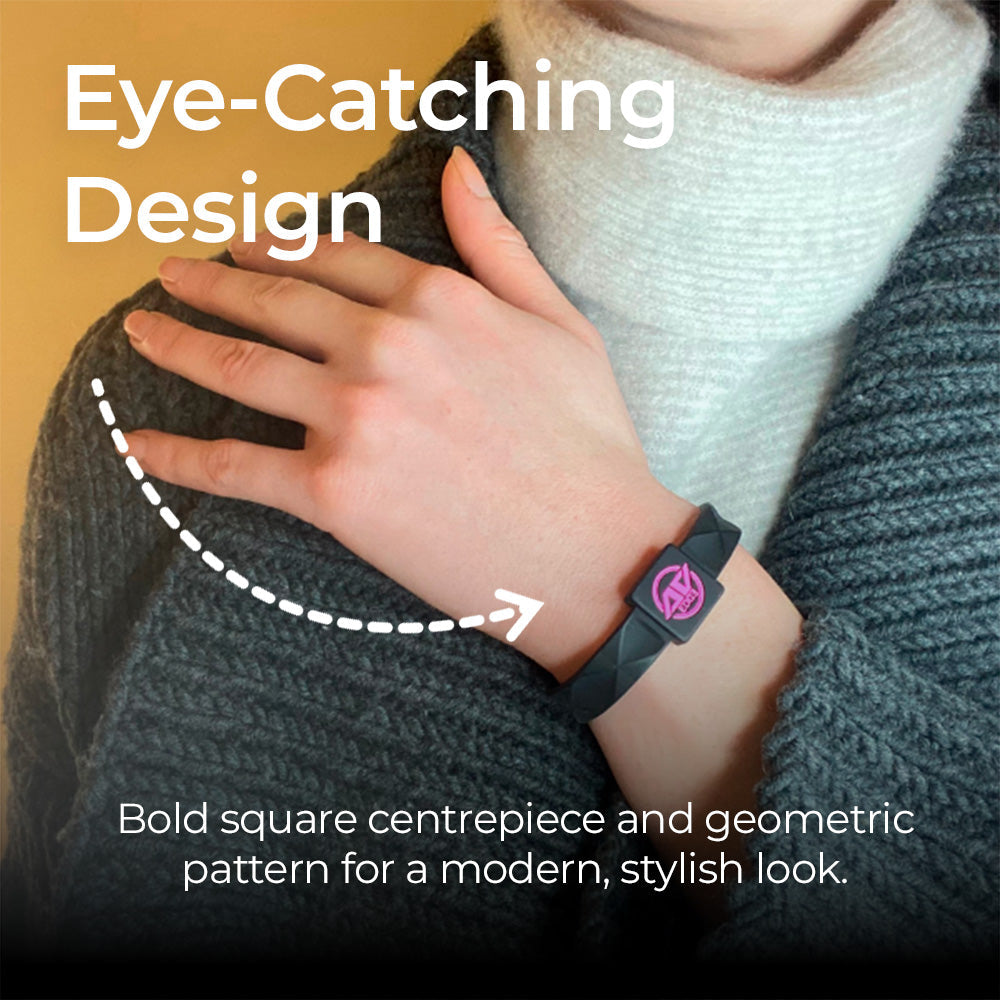 A close-up of a person wearing the AV Edge Advanced Black/Pink frequency wristband, highlighting how the geometric design might support focus and balance during daily activities, offering potential relief from vertigo symptoms and fatigue.