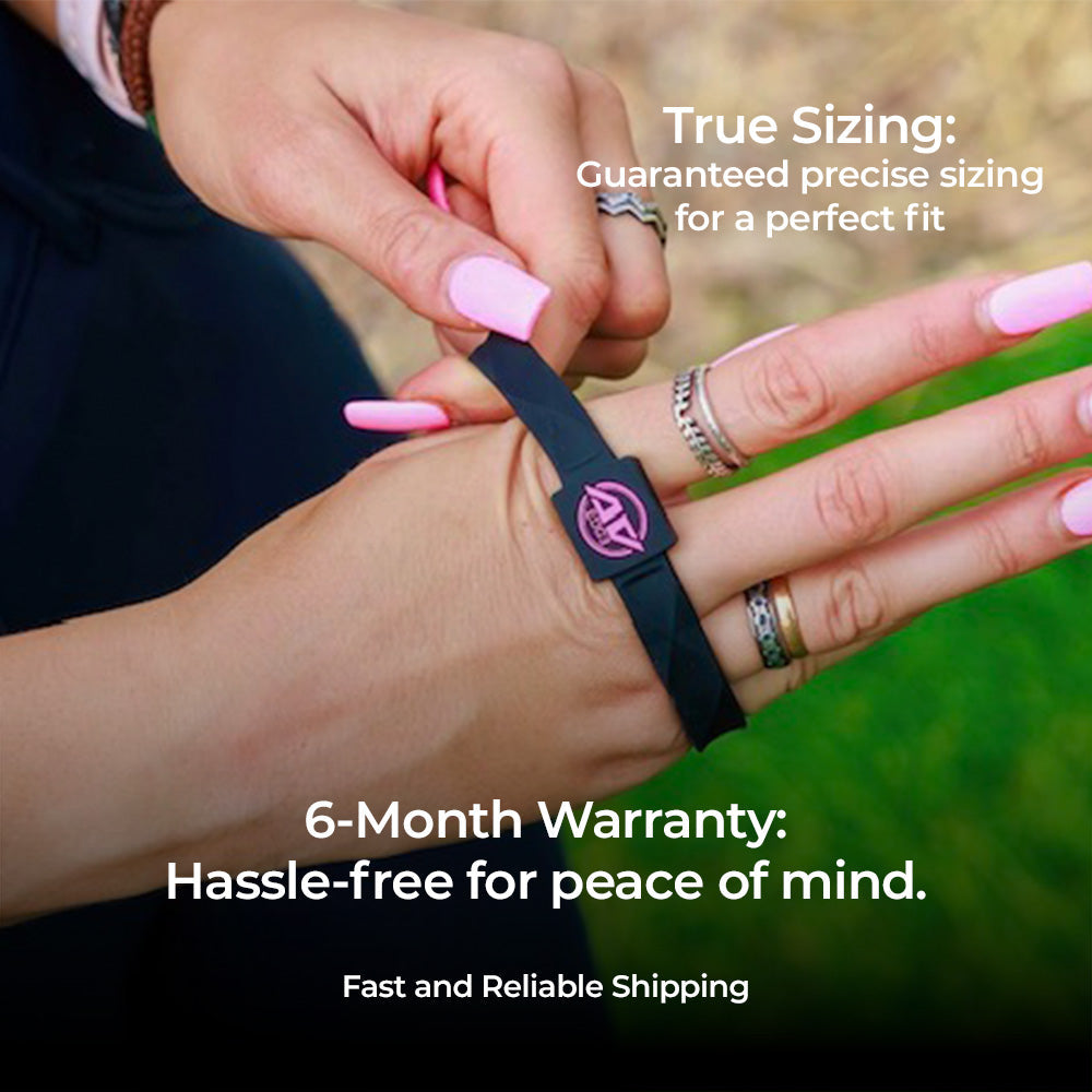A close-up of a person wearing the AV Edge Advanced Black/Pink frequency wristband during outdoor activity, demonstrating how the geometric performance design might support enhanced cellular energy and focus for an active, dynamic lifestyle, while offering potential natural EMF protection.