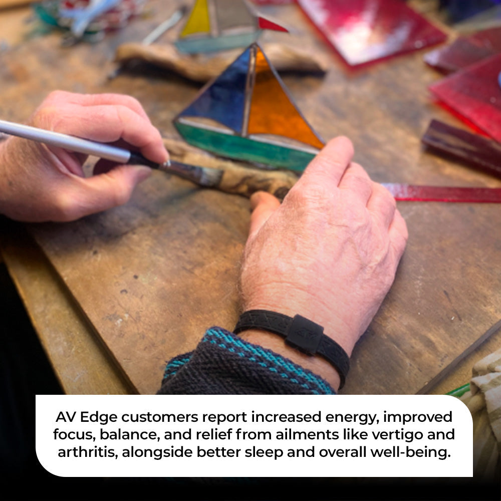 AV Edge Legend Noir frequency bracelet worn by an artisan crafting stained glass, demonstrating how non-magnetic technology might support improved focus, balance, and energy while potentially providing natural relief from arthritis or joint stiffness during delicate handiwork.
